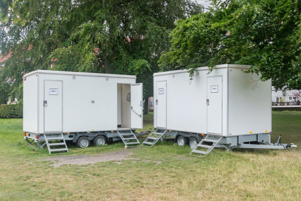 Mobile restroom trailers in park setting