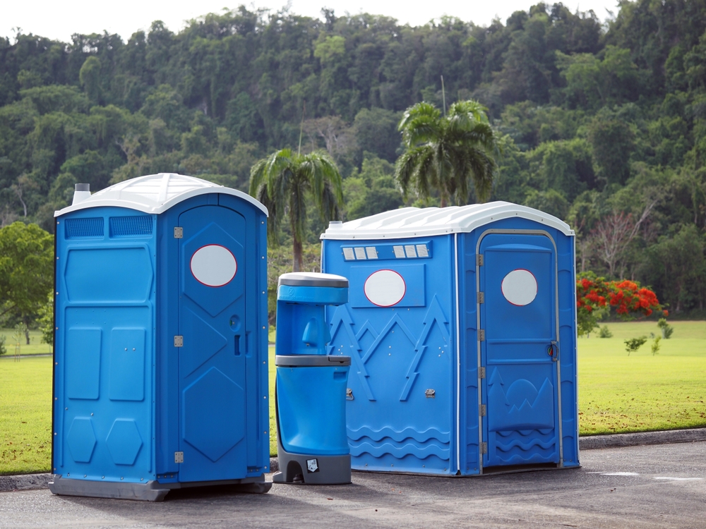 row of portable restrooms at event